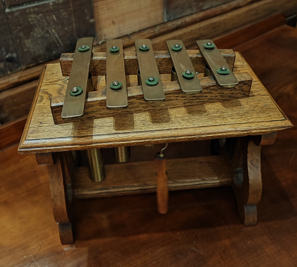 Antique oak and brass table top dinner chimes 
