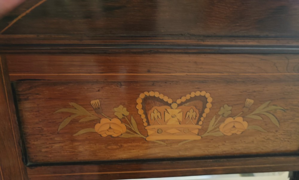 A Victorian marquetry rosewood hanging mirror. View V