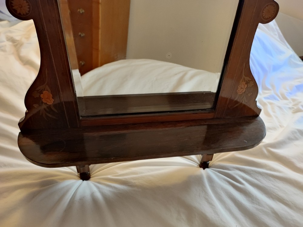 A Victorian marquetry rosewood hanging mirror. View IX