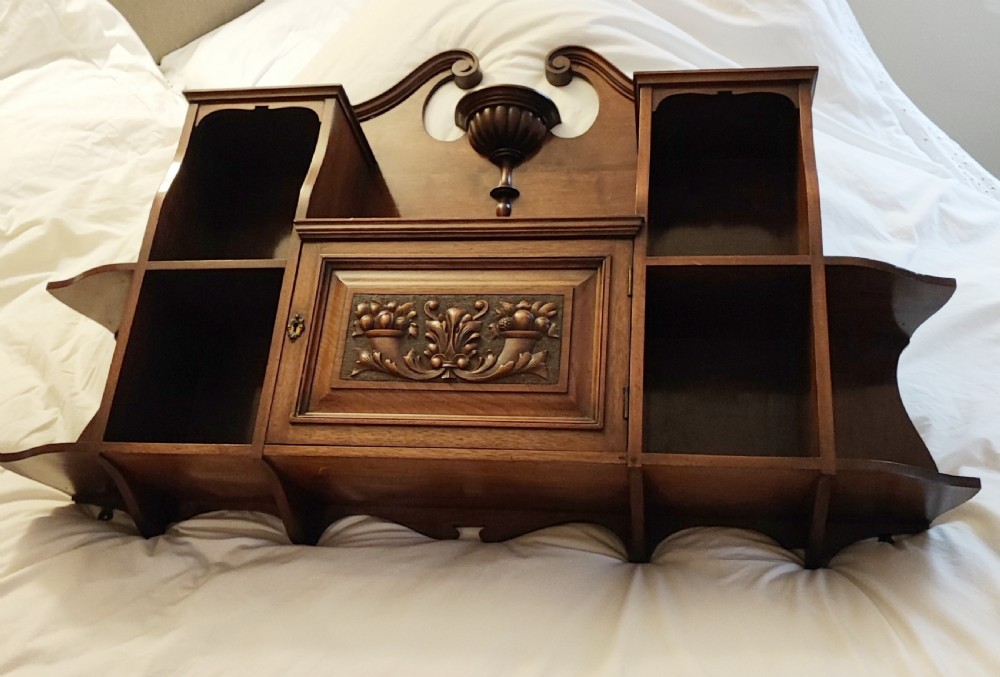 An antique mahogany hanging wall shelf with cabinet. View II