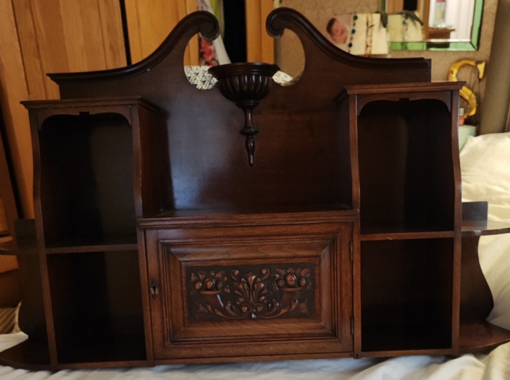An antique mahogany hanging wall shelf with cabinet. View V