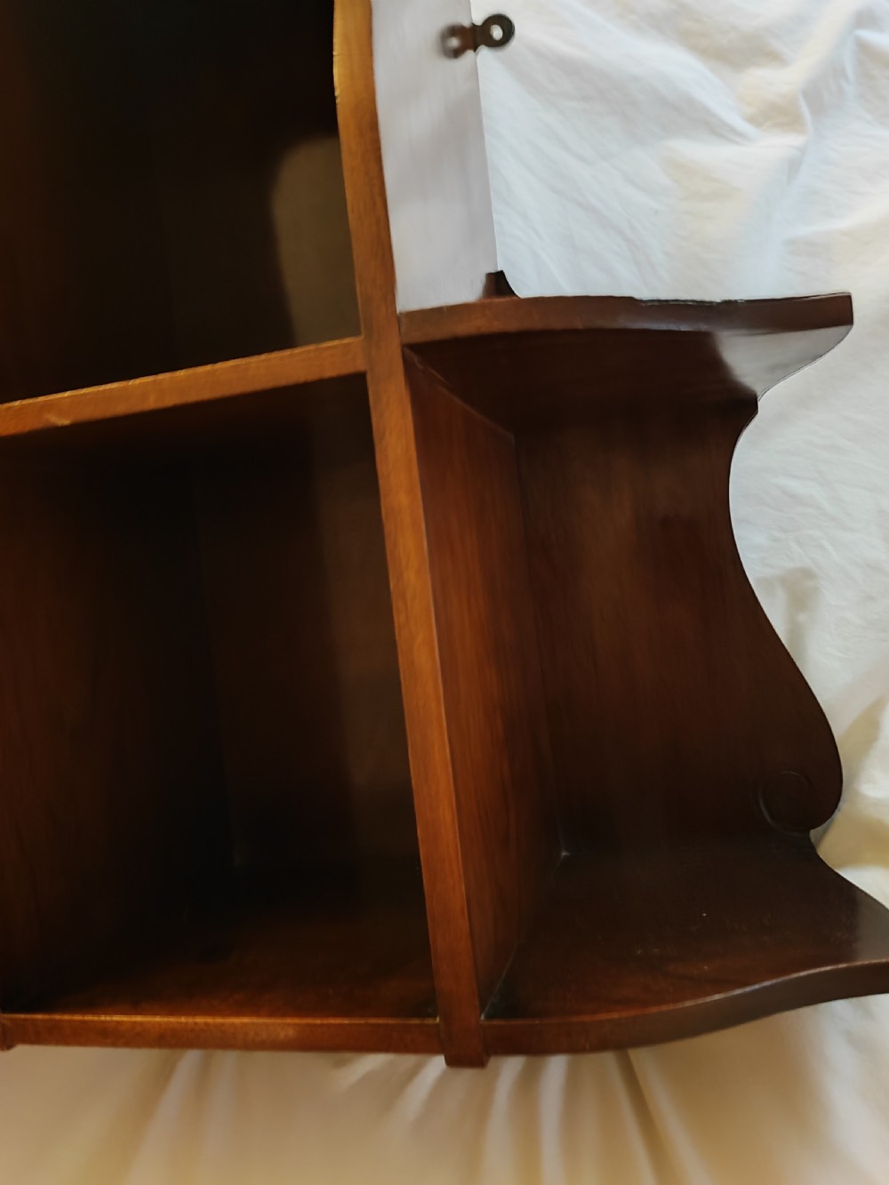 An antique mahogany hanging wall shelf with cabinet. View VI