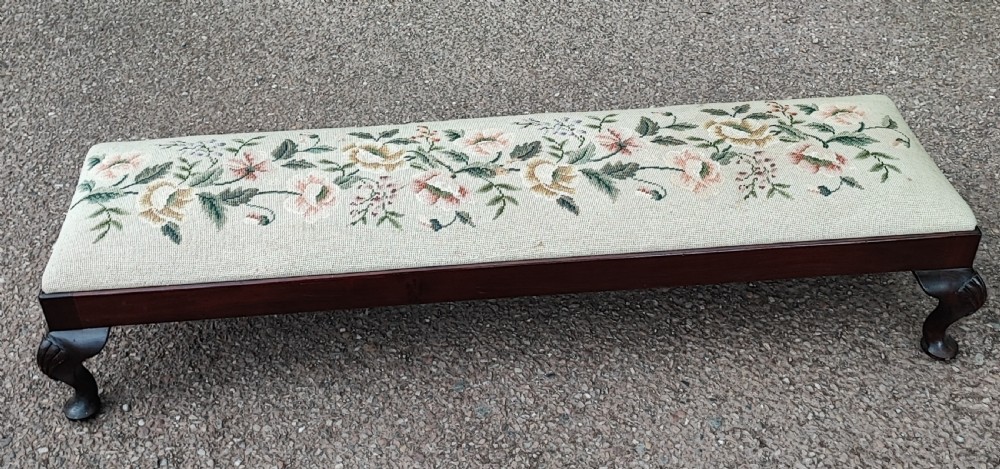 An antique long mahogany stool in the Queen Anne style. View III