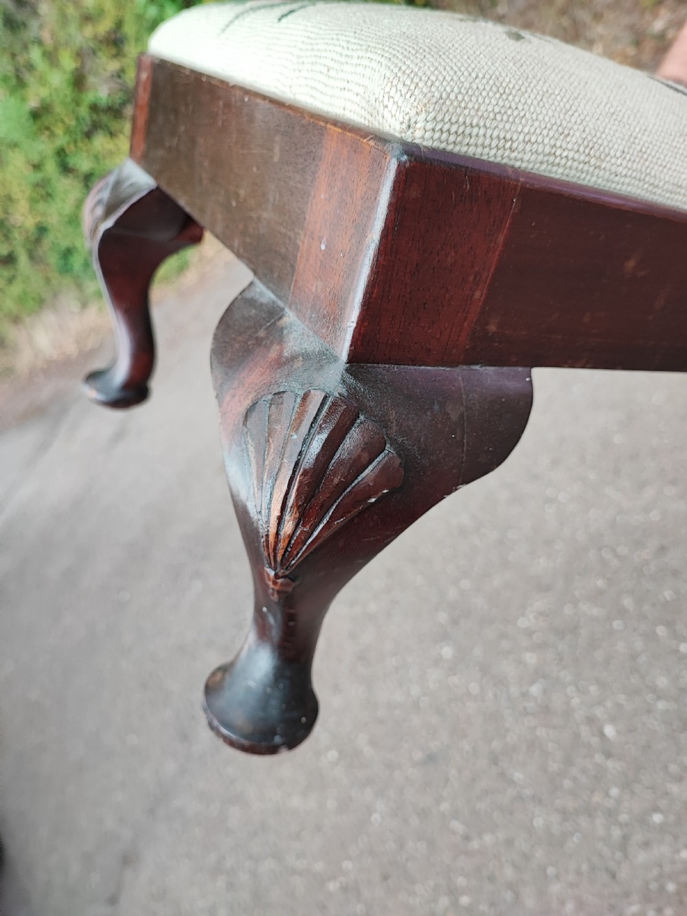 An antique long mahogany stool in the Queen Anne style. View IV