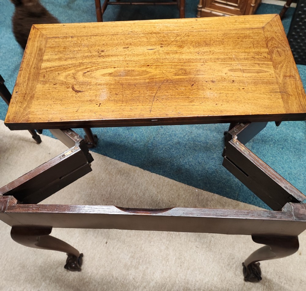 A fine George ll red walnut concertina tea table  View XVI