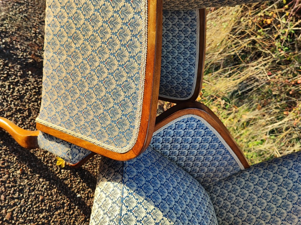 A pair of art deco upholstered armchairs. View X