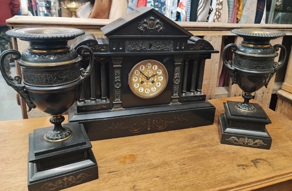 An impressive 3 piece Victorian bronze and slate clock garniture.