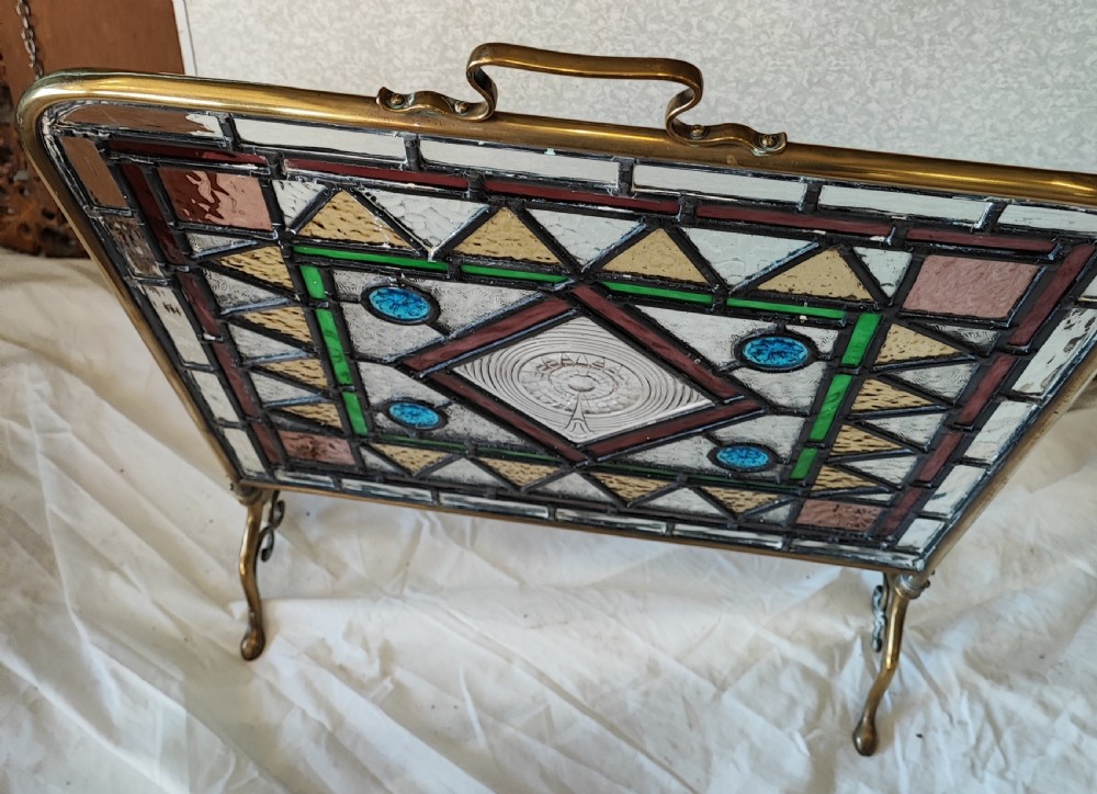 A Victorian brass framed stained glass firescreen. View IV