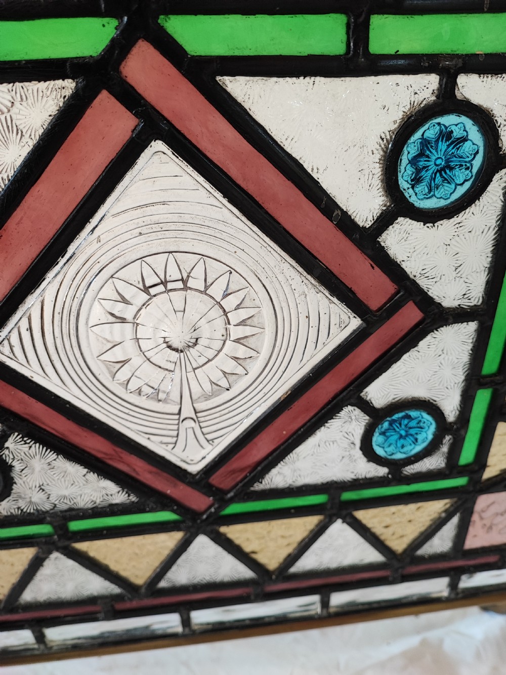 A Victorian brass framed stained glass firescreen. View VII