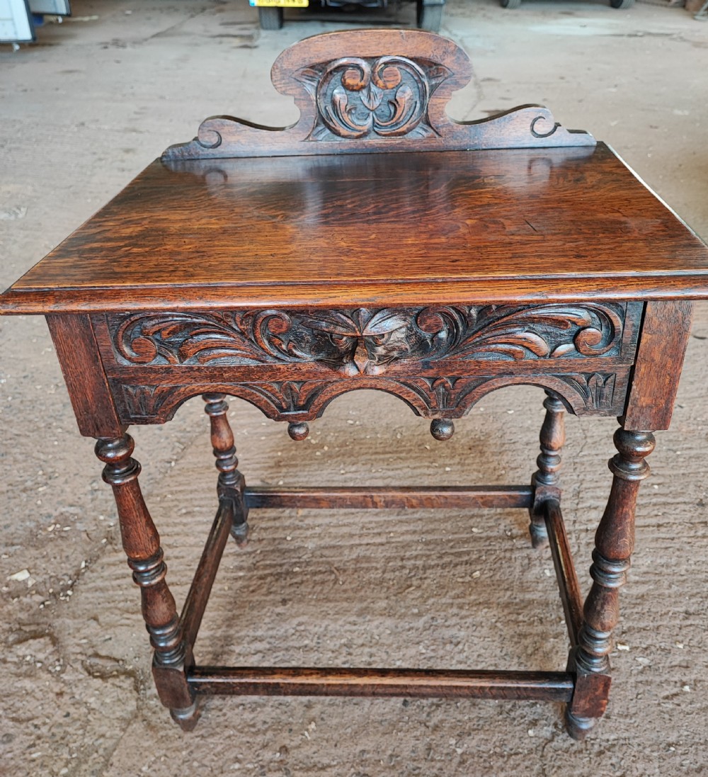 Victorian (Green Man ) carved oak side table.
