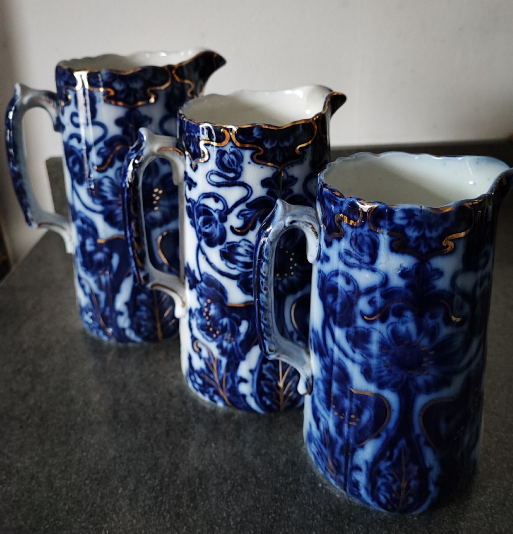 Good set of 3 Victorian Staffordshire flo Blue jugs. View VII