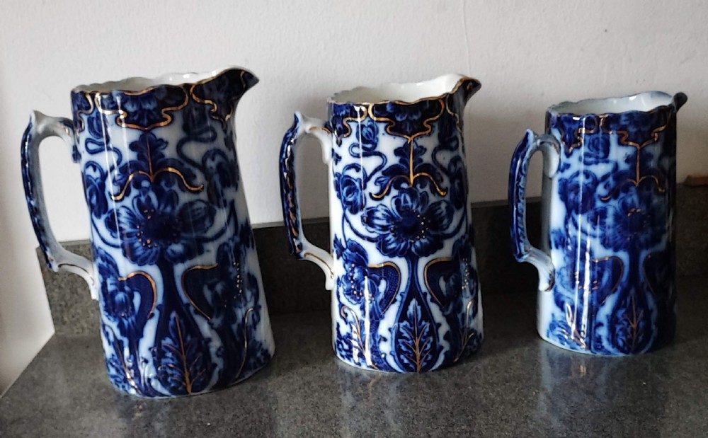 Good set of 3 Victorian Staffordshire flo Blue jugs. View XIII