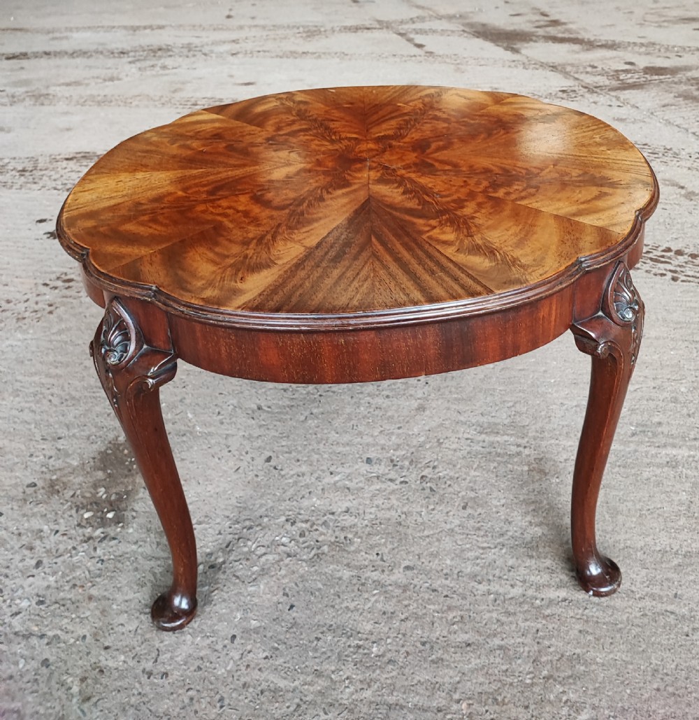 Antique circular figured mahogany coffee table.