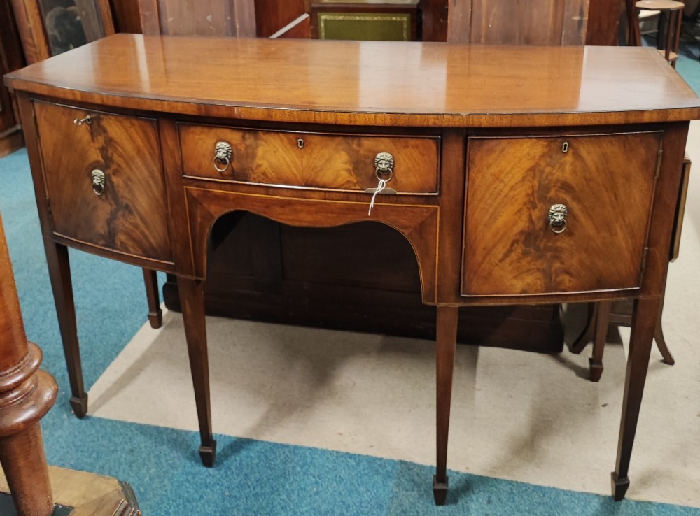 Antique bow front mahogany sideboard in the George III style.