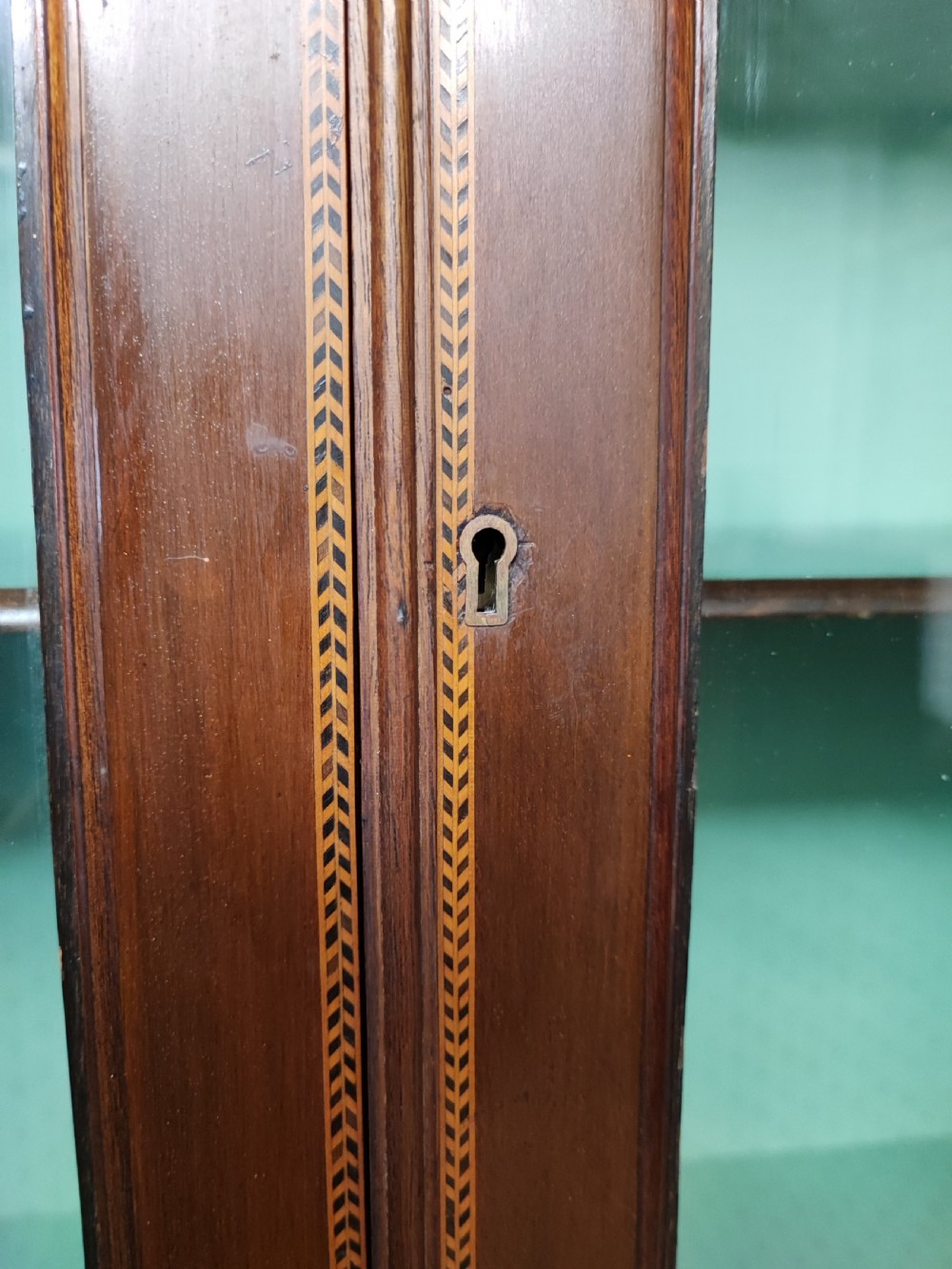 An Edwardian inlaid arts and crafts display cabinet. View IV