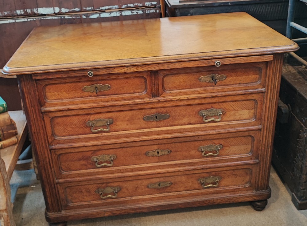 Antique French oak chest of drawers with writing slide. View II