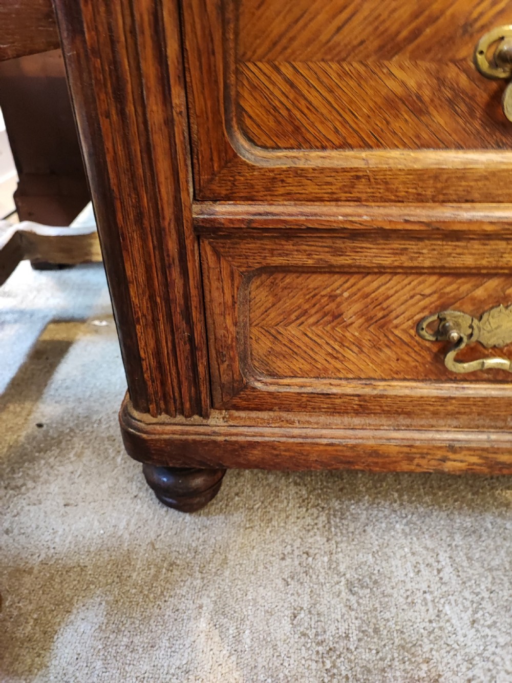 Antique French oak chest of drawers with writing slide. View VIII