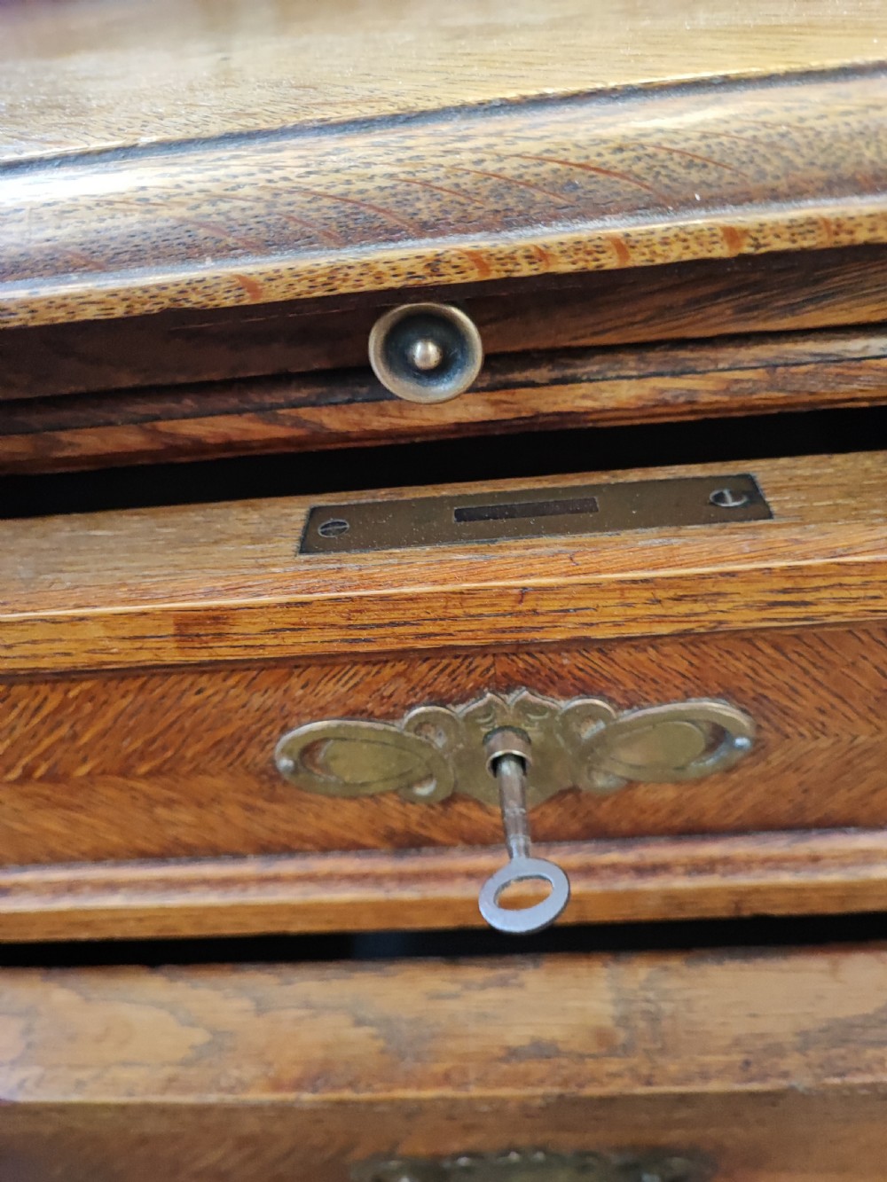 Antique French oak chest of drawers with writing slide. View XI
