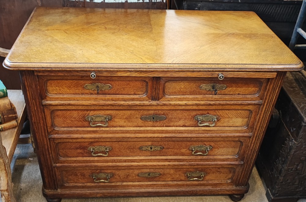 Antique French oak chest of drawers with writing slide. View XVI