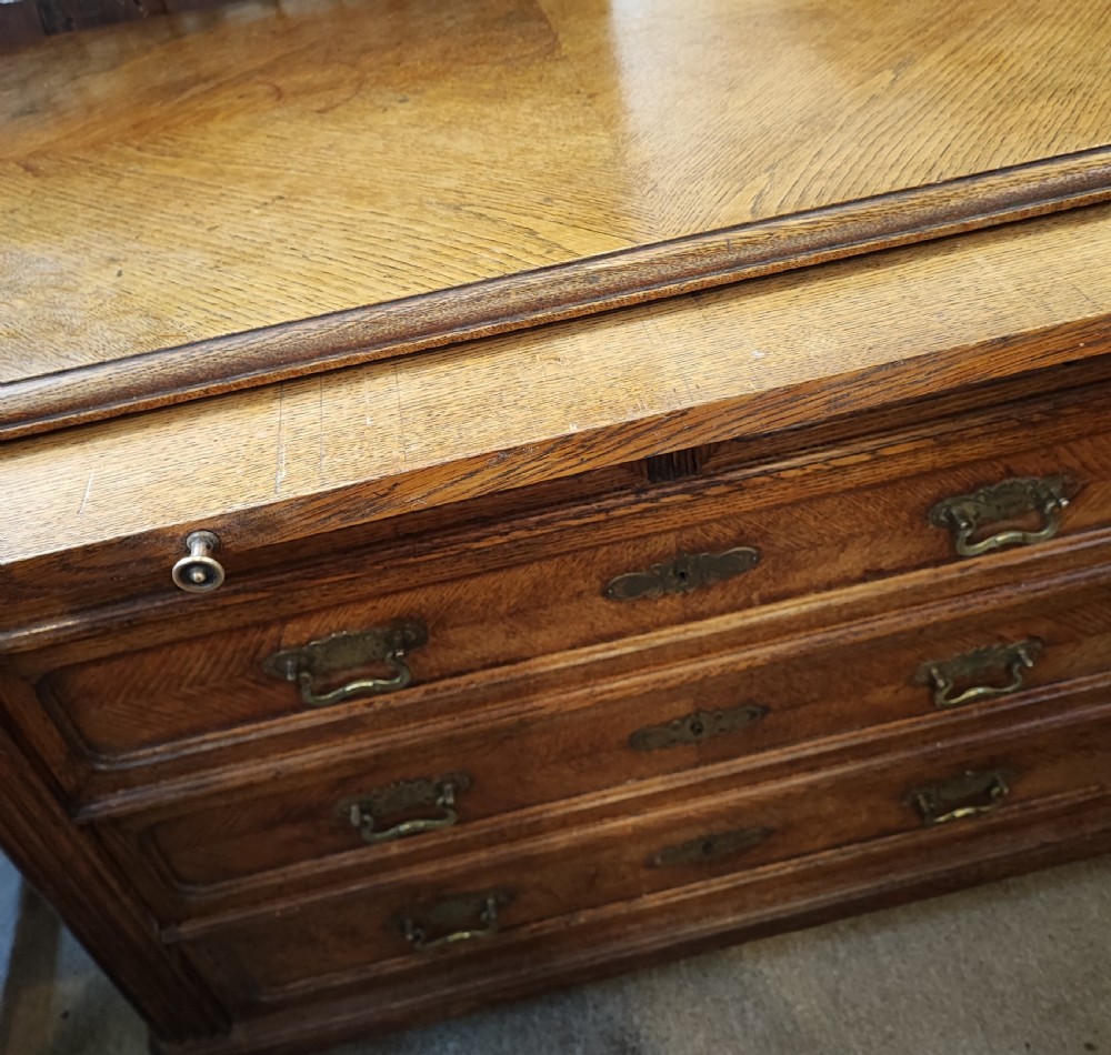 Antique French oak chest of drawers with writing slide. View XVII