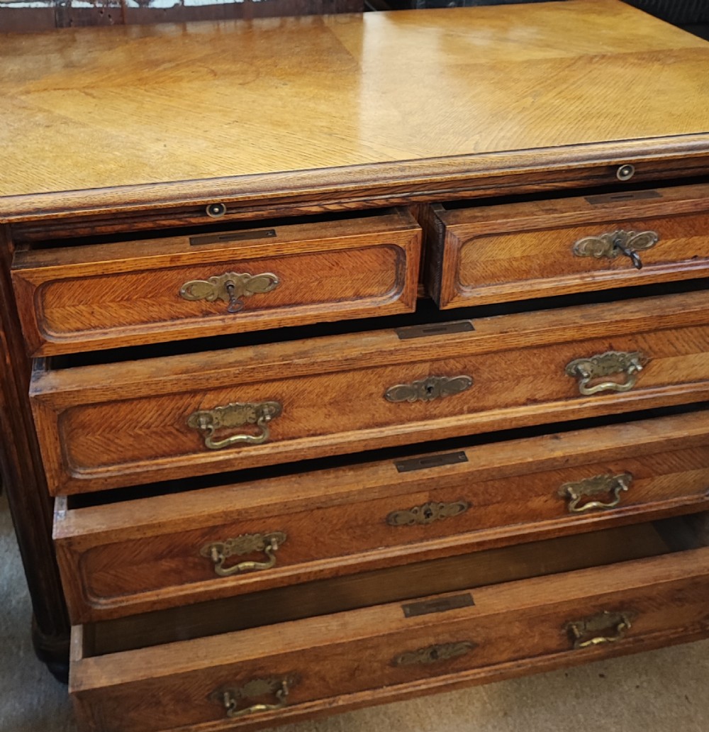 Antique French oak chest of drawers with writing slide. View XVIII