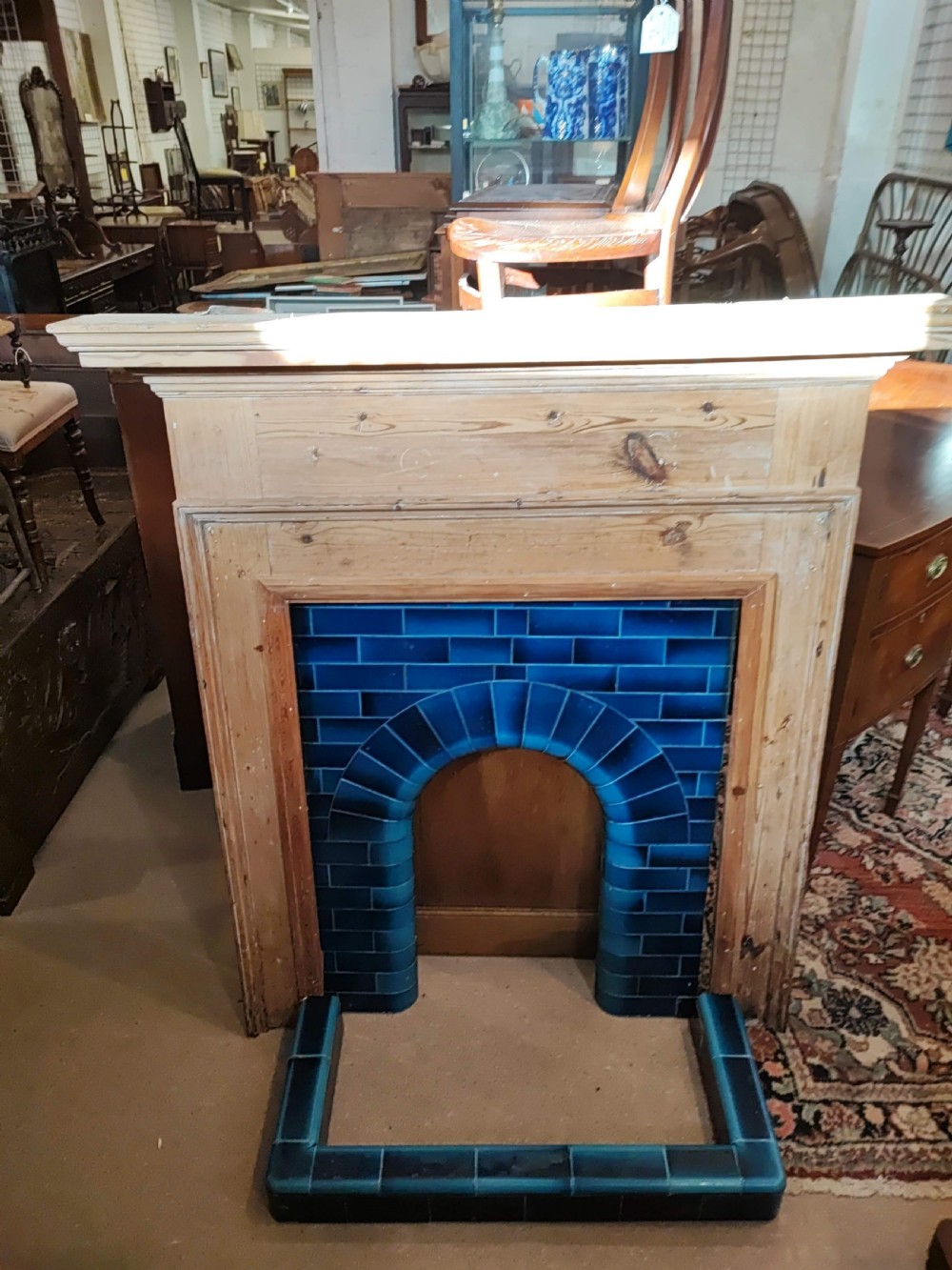 An antique pine fireplace and surround. View III