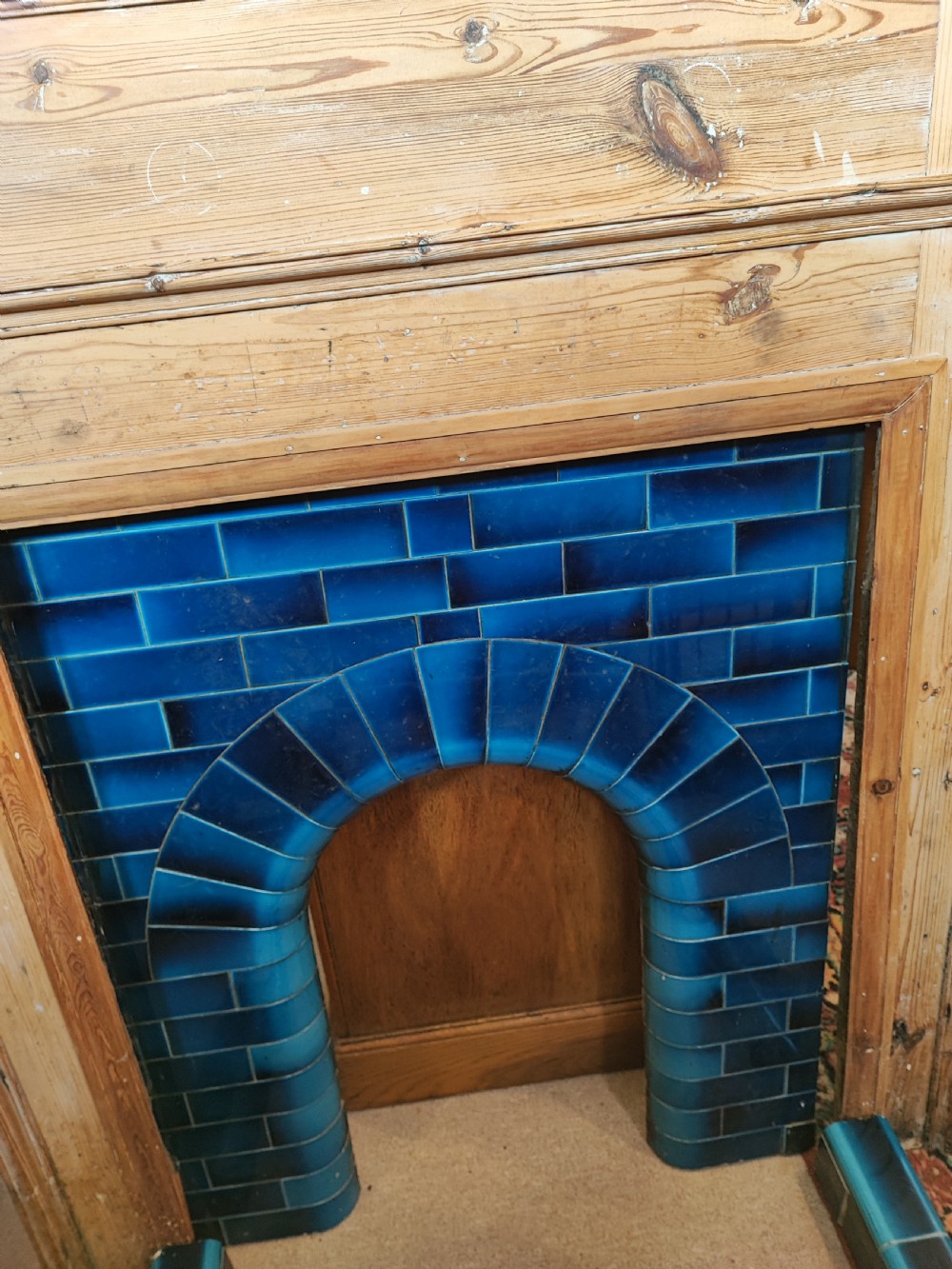 An antique pine fireplace and surround. View V