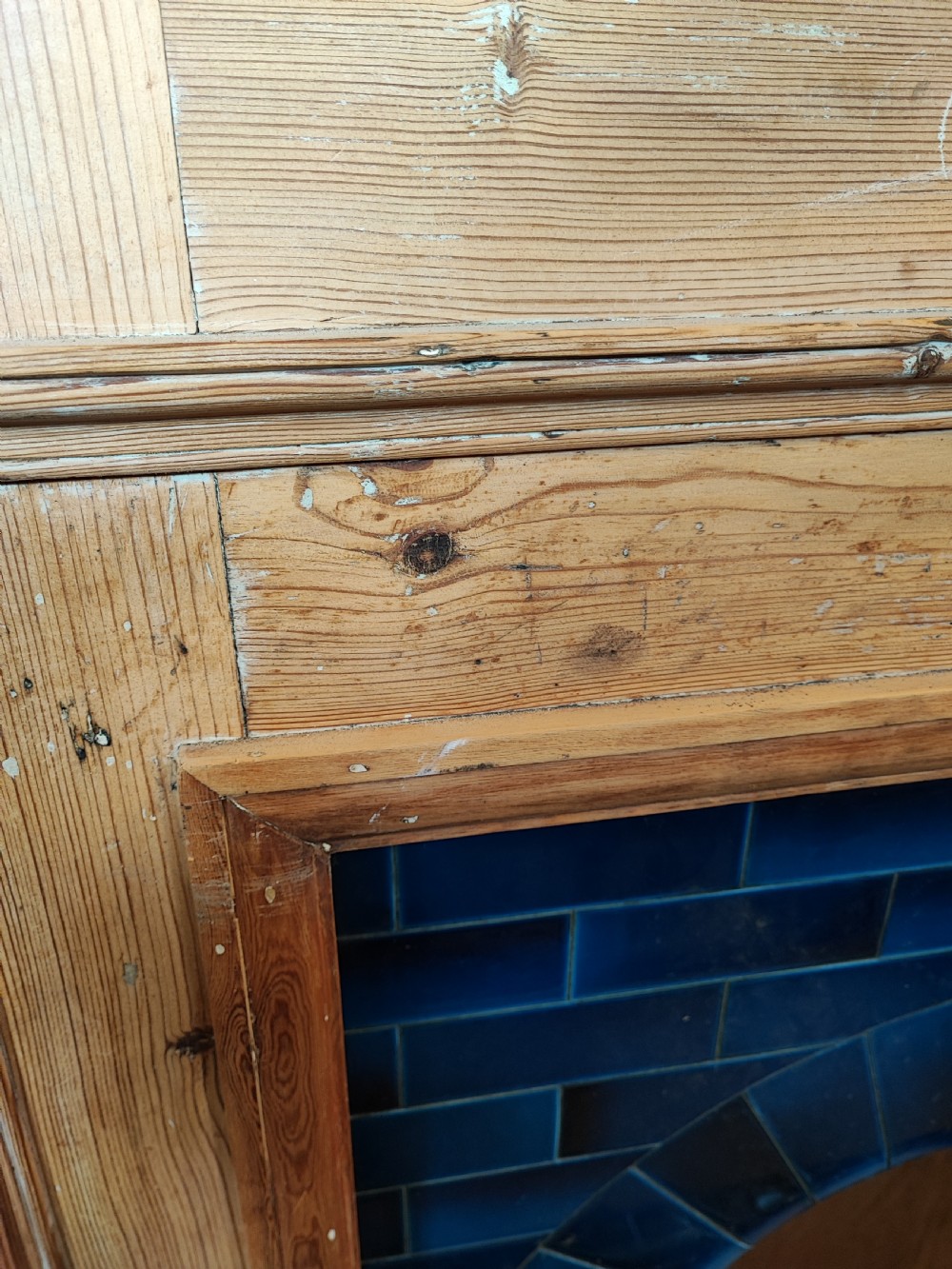 An antique pine fireplace and surround. View VII