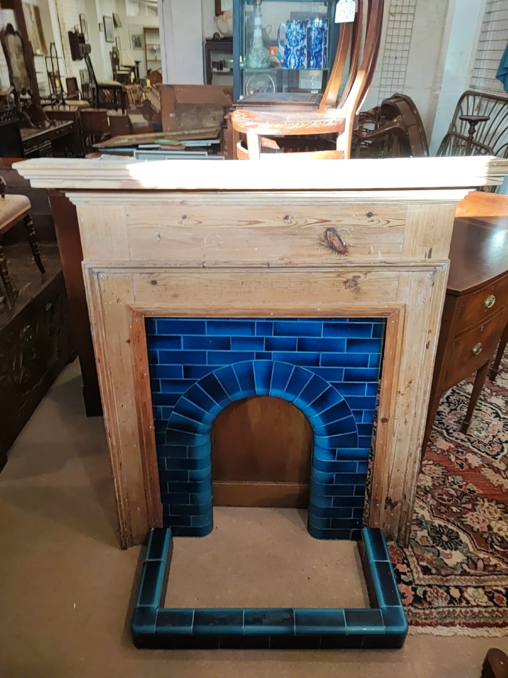 An antique pine fireplace and surround. View IX