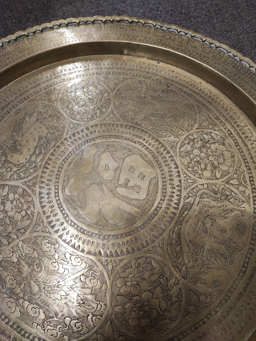An antique brass topped middle Eastern coffee table. View II