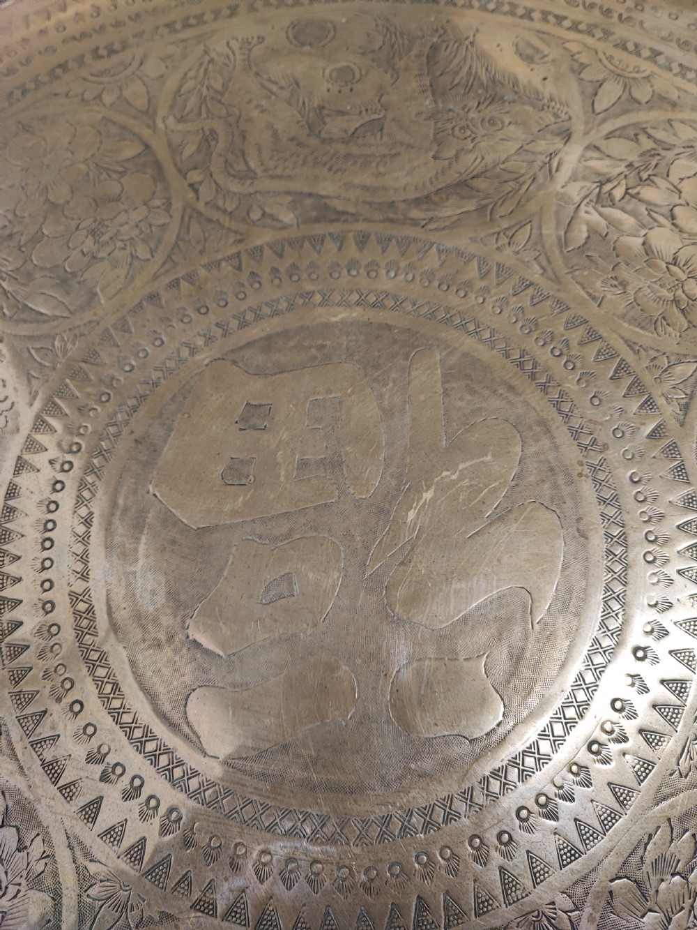 An antique brass topped middle Eastern coffee table. View IV