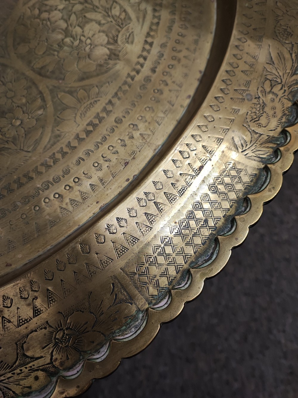An antique brass topped middle Eastern coffee table. View XII