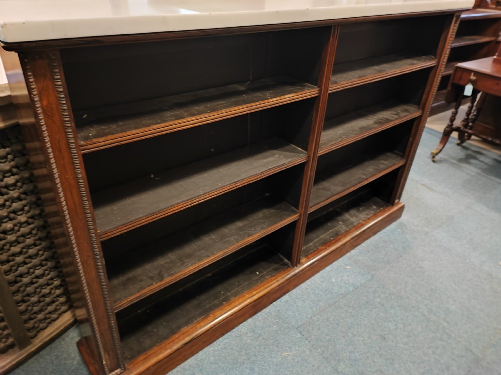 Regency rosewood open bookcase with original white marble top. View VIII