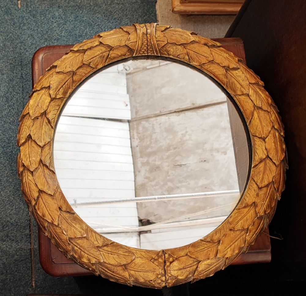 Regency carved giltwood wreath mirror.