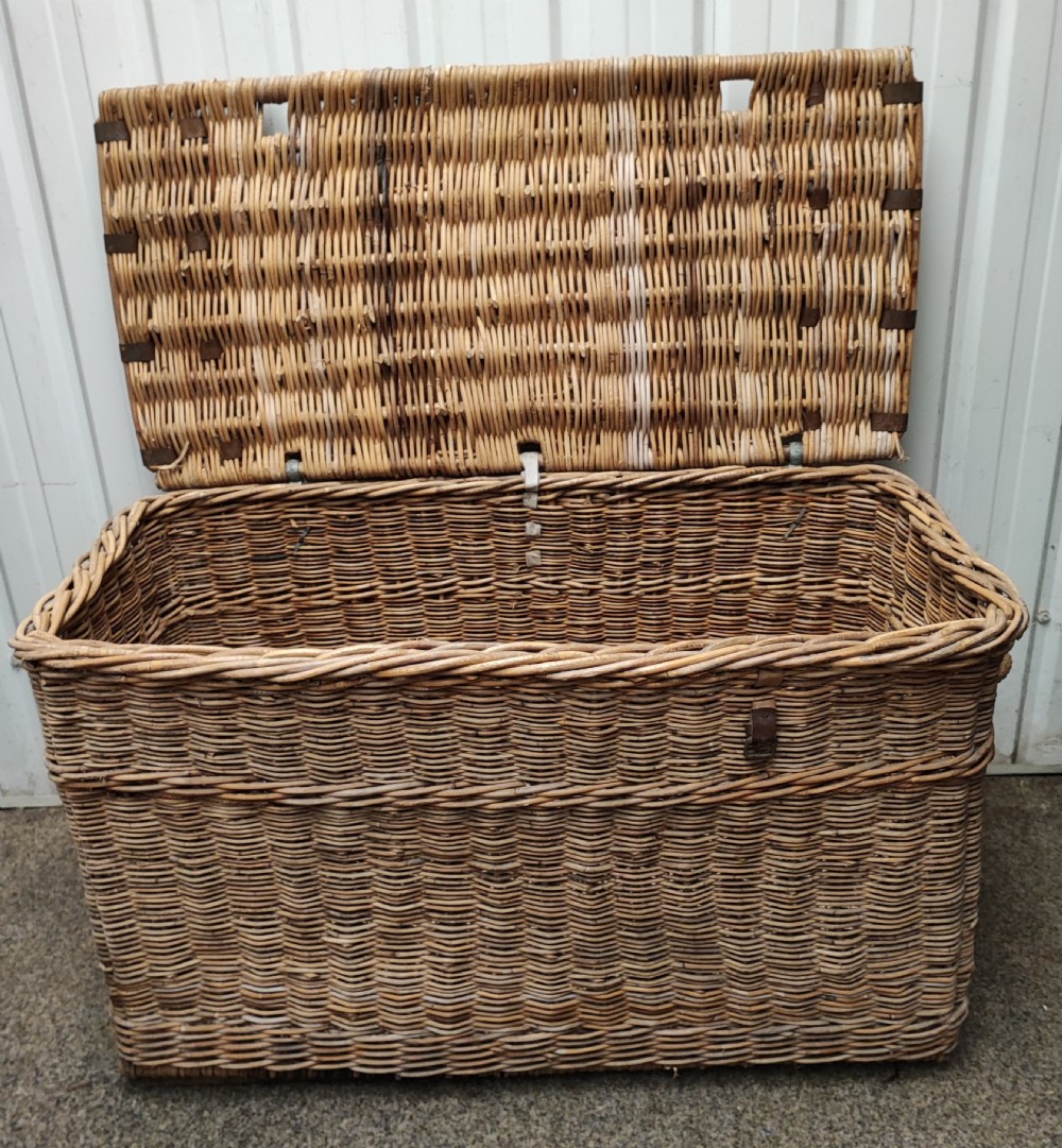 Antique wicker log or laundry basket of extra large size.