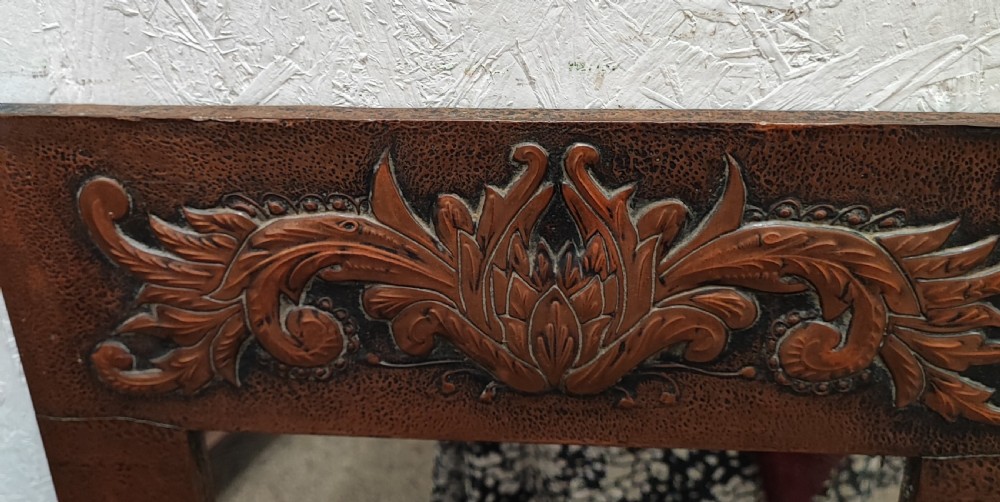 An antique arts and crafts copper framed mirror. View VI