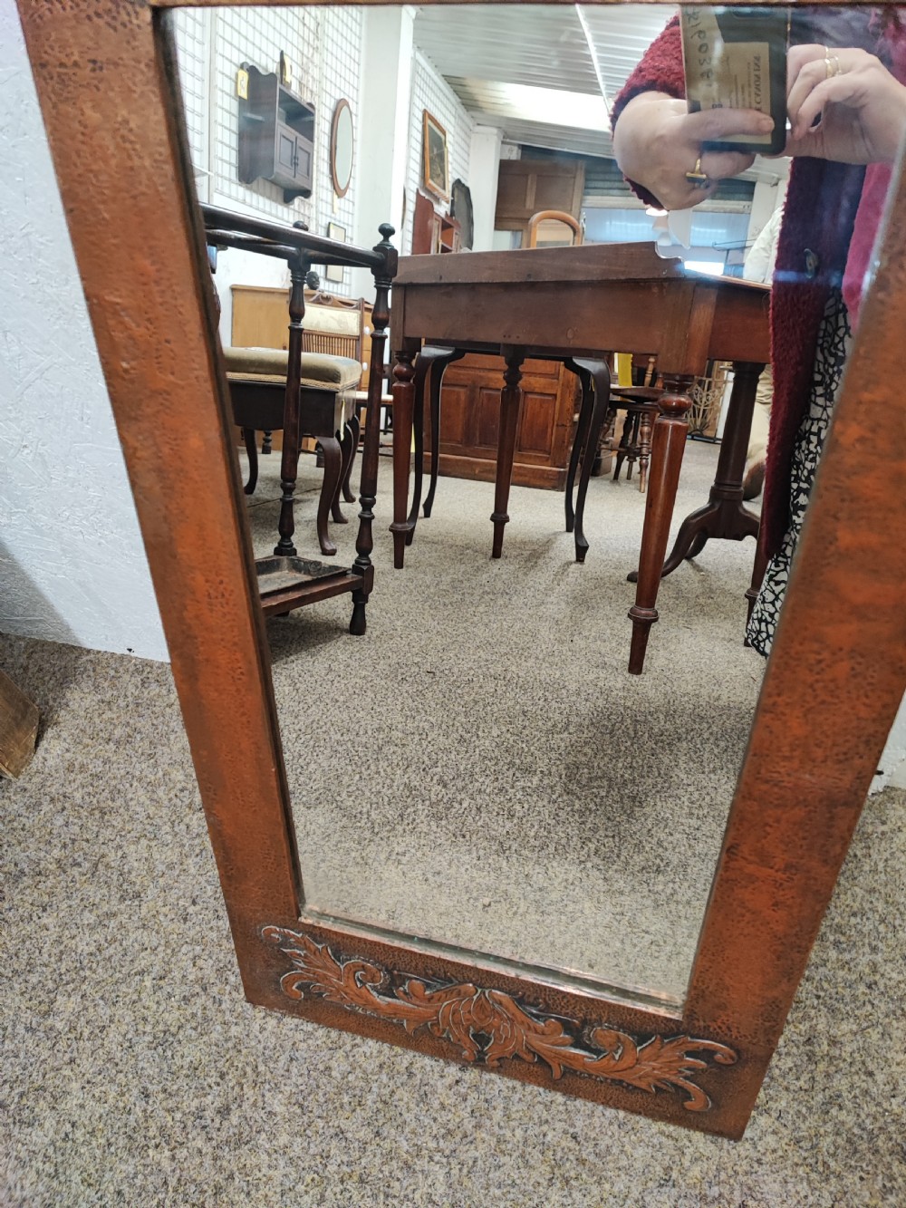 An antique arts and crafts copper framed mirror. View VIII