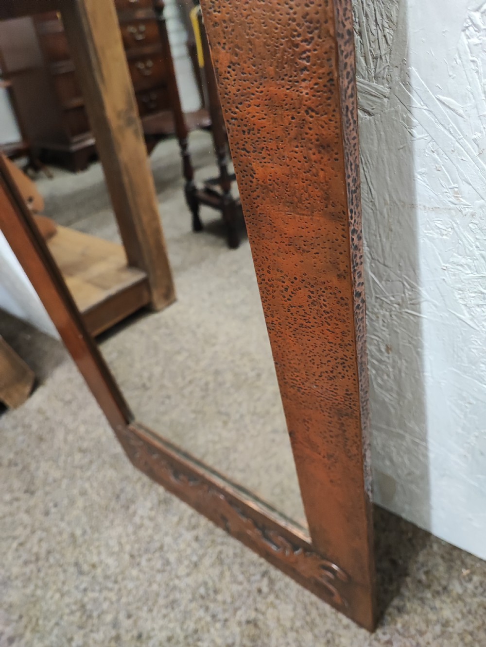 An antique arts and crafts copper framed mirror. View X