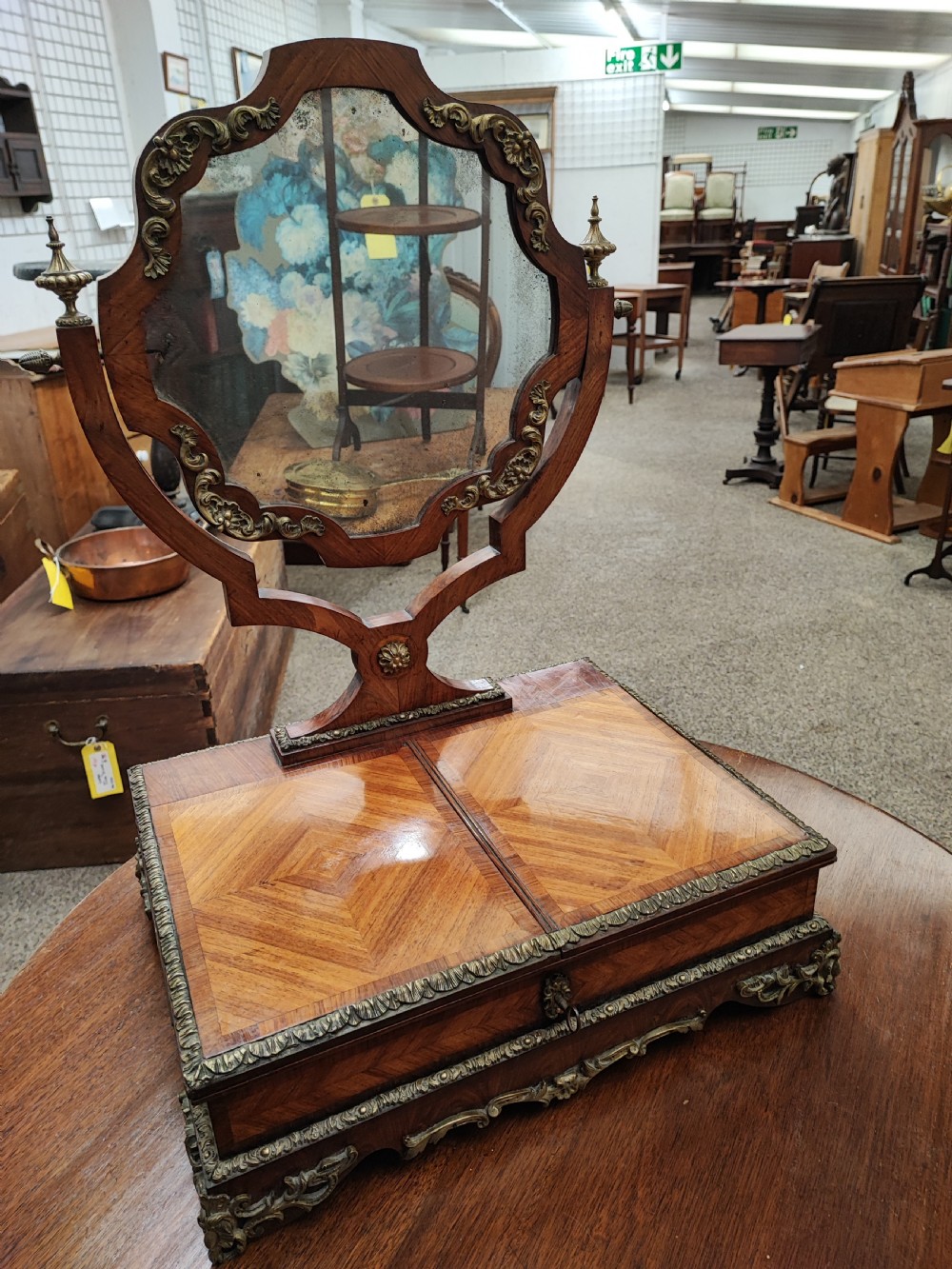 A fine French Kingwood and ormolu dressing mirror.