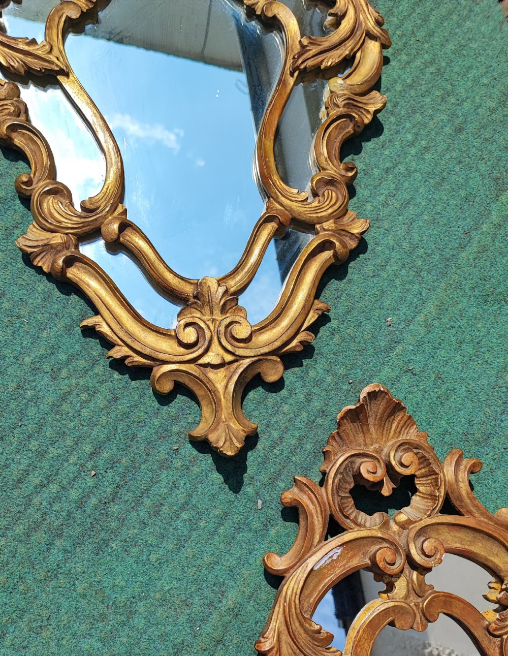 An antique pair of carved Italian giltwood mirrors. View V
