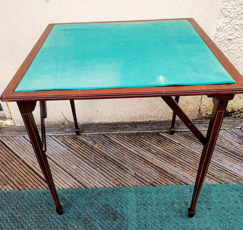 Edwardian inlaid folding card or games table.