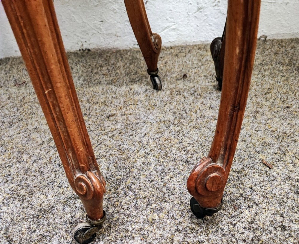 An antique matched pair of French marble top bedside cabinets.  View X