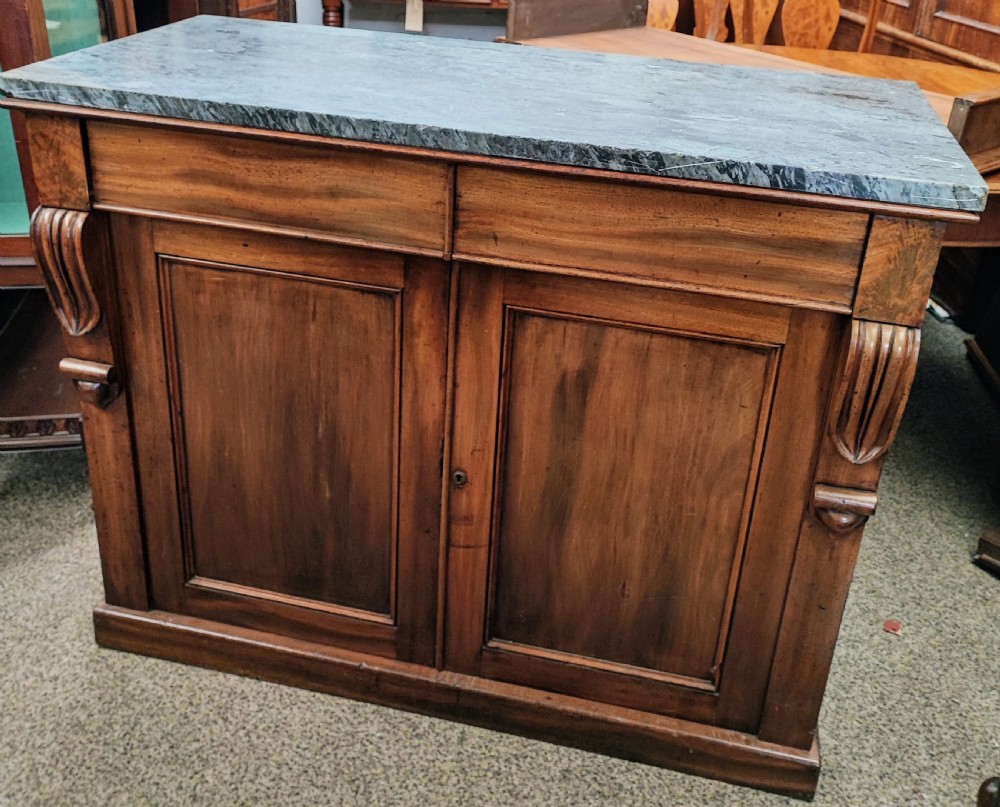 A fine Regency marble top mahogany side cabinet.