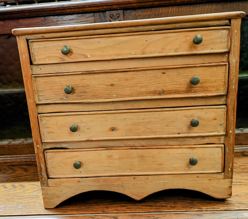 19c miniature pine chest of drawers.