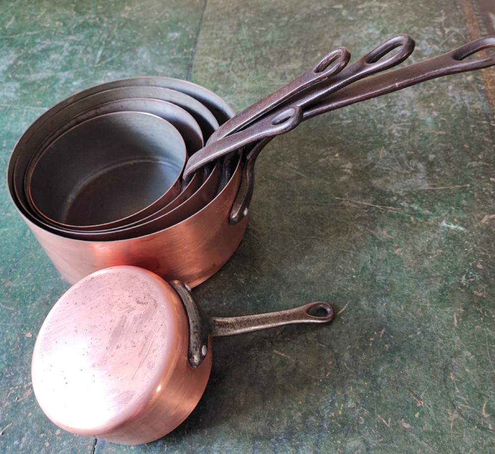 An antique Set of 5 French graduated copper and iron pans View V
