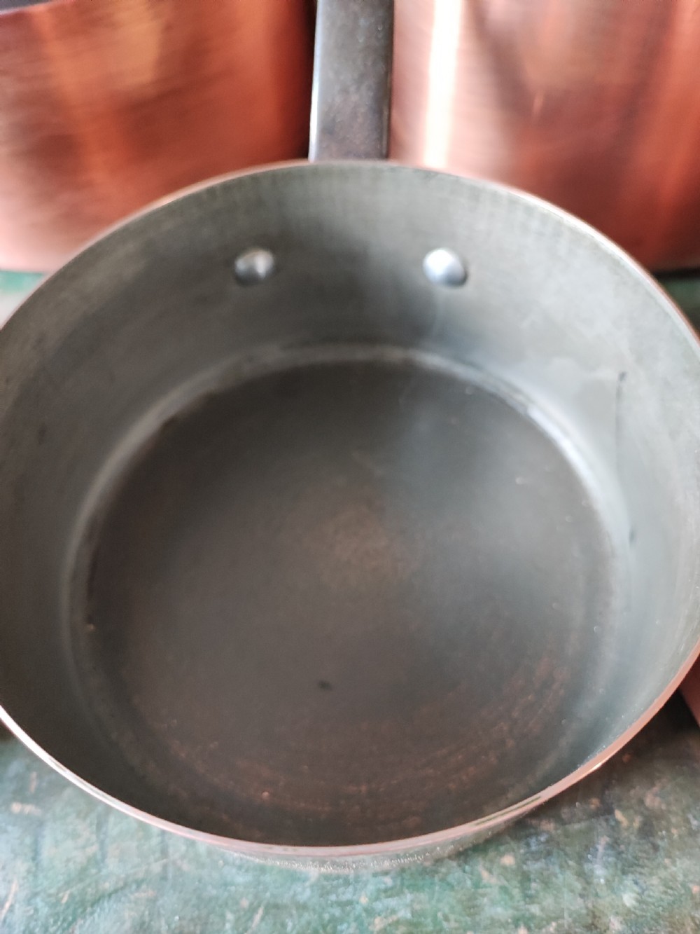 An antique Set of 5 French graduated copper and iron pans View IX