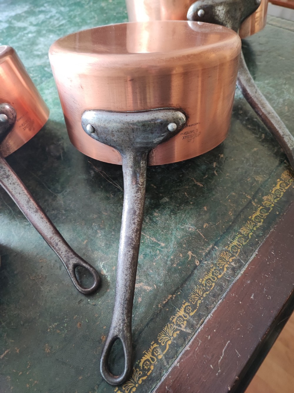 An antique Set of 5 French graduated copper and iron pans View XI