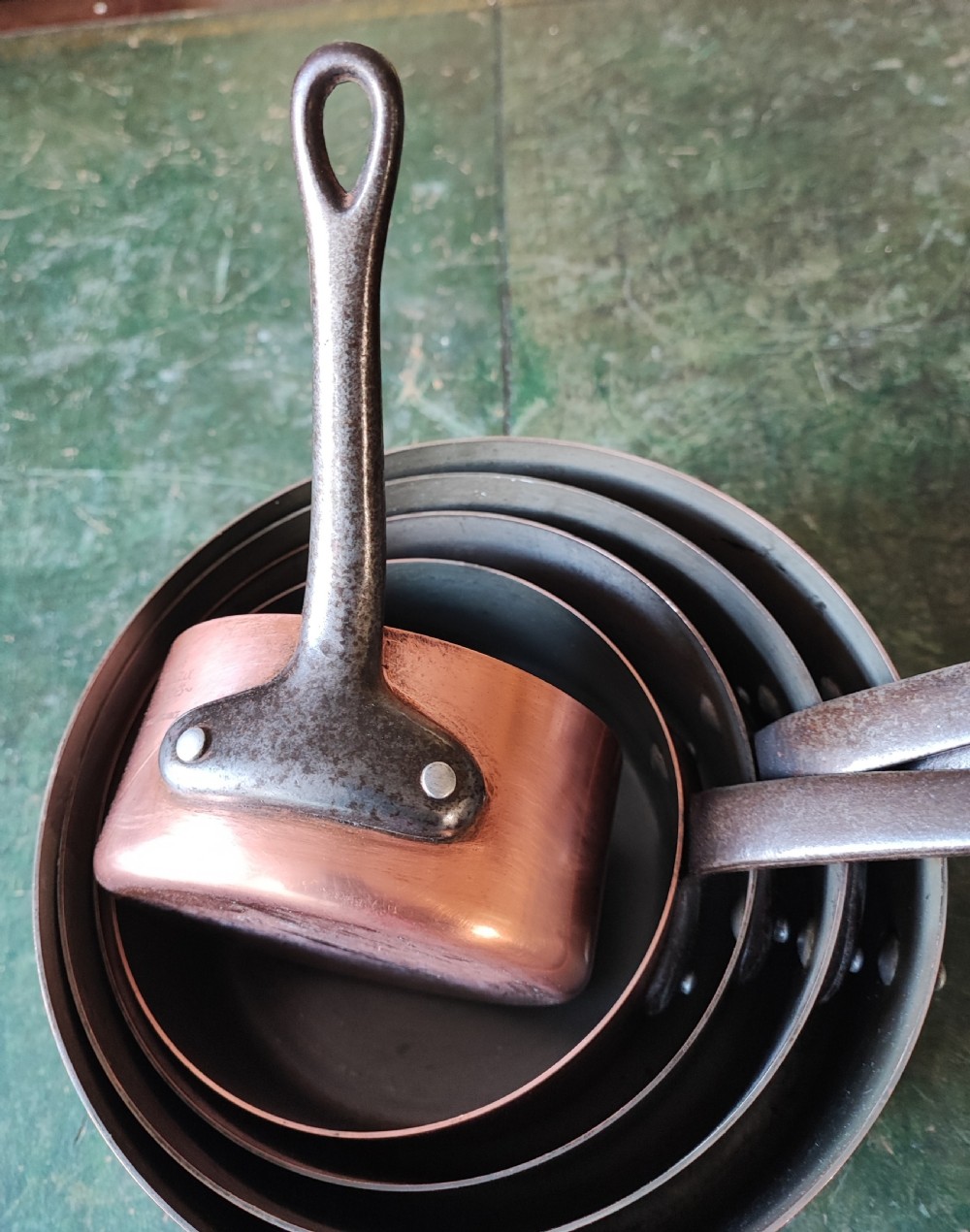 An antique Set of 5 French graduated copper and iron pans View XII