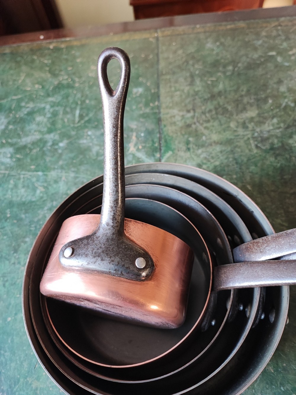 An antique Set of 5 French graduated copper and iron pans View XIII