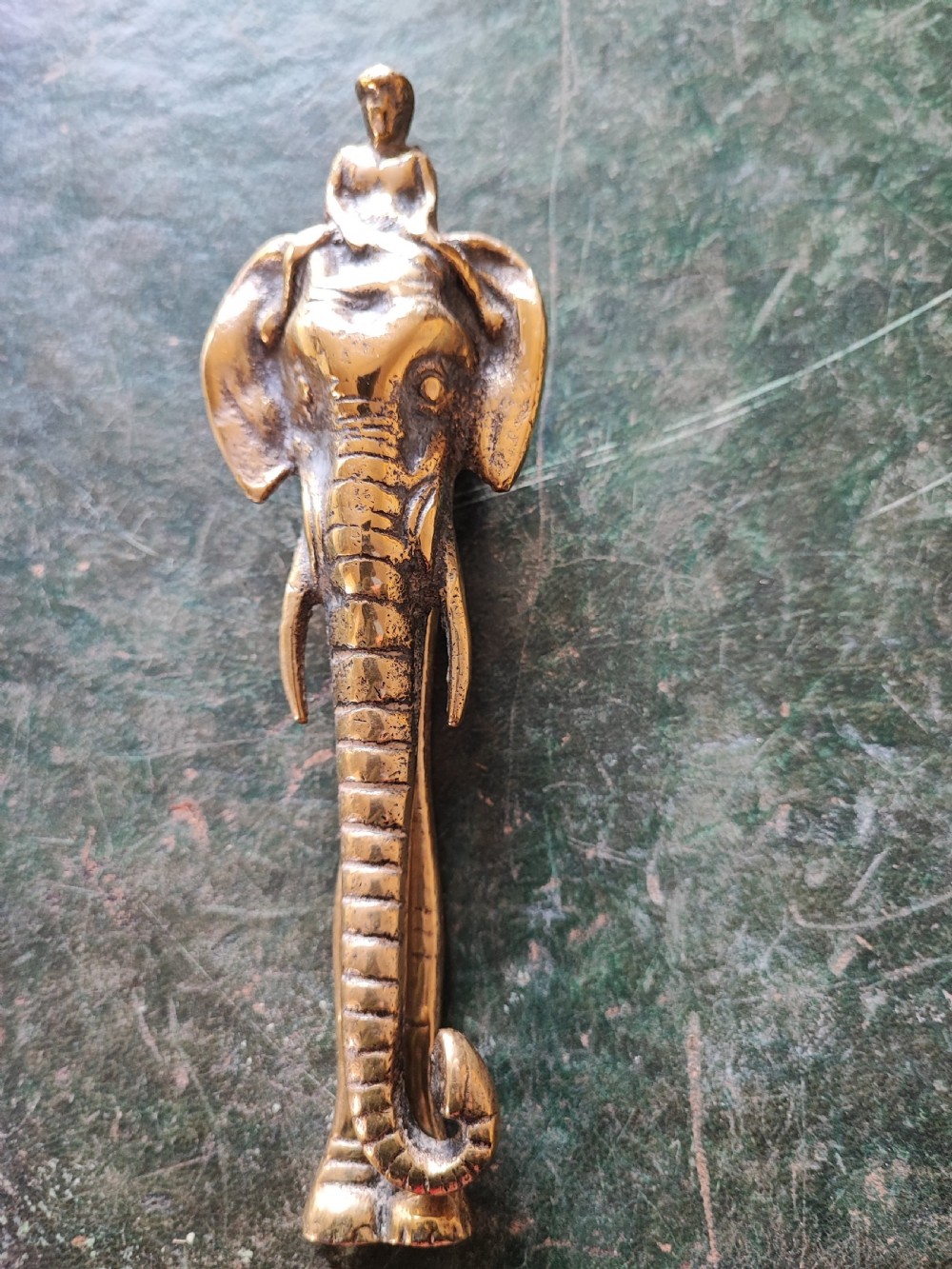A Victorian brass elephant door knocker.